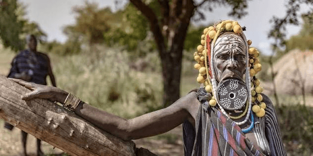 A Mursi woman in a beaded headdress in the Omo Valley