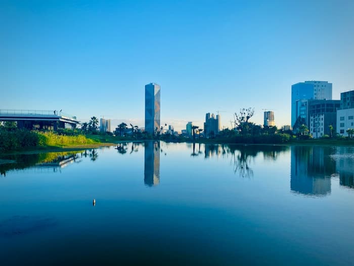 The lake at Friendship Park with the Addis Ababa skyline behind it